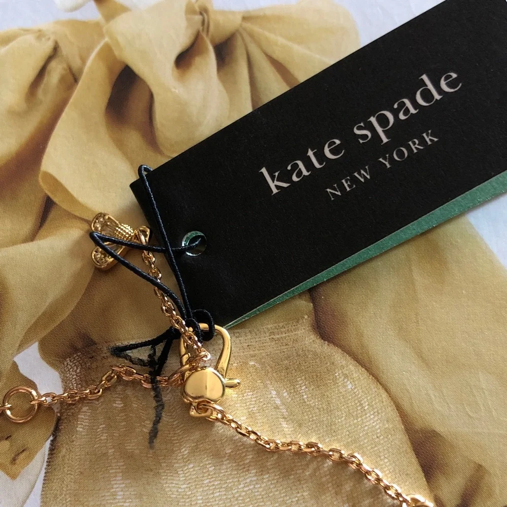 Authentic New with tag. kate spade Gold Bracelet with flower crystals.